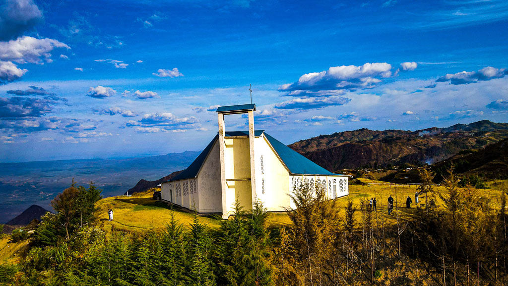 The first missionaries in the Kerio Valley were the Mill Hill and the Kiltegan Fathers. They rooted the Christian faith by founding a small Christian community in Chesongoch. The Benedictines took over the responsibility of evangelisation among the Marakwets in 1972. For the running of the mission, a kind of base or warehouse was needed in Eldoret town.